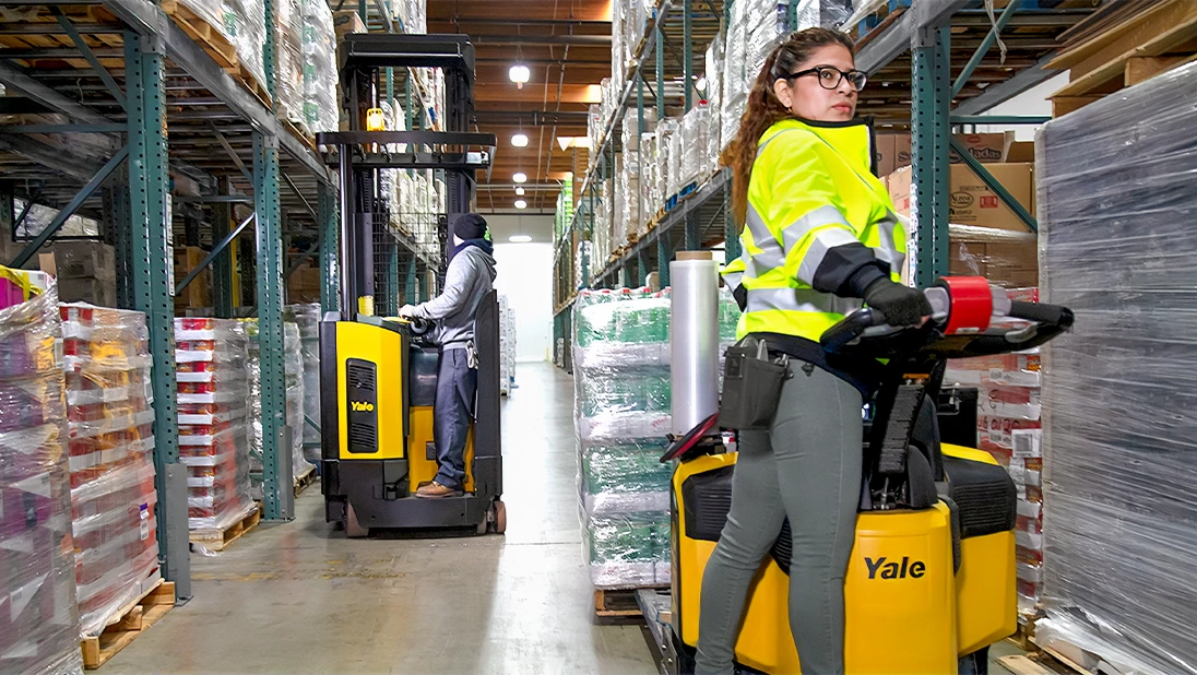 Yale reach truck and Yale end rider in warehouse.