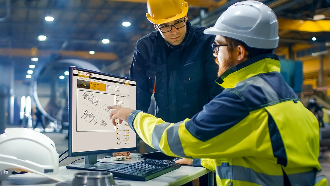 Men shopping for HYSource forklift parts on a computer. 