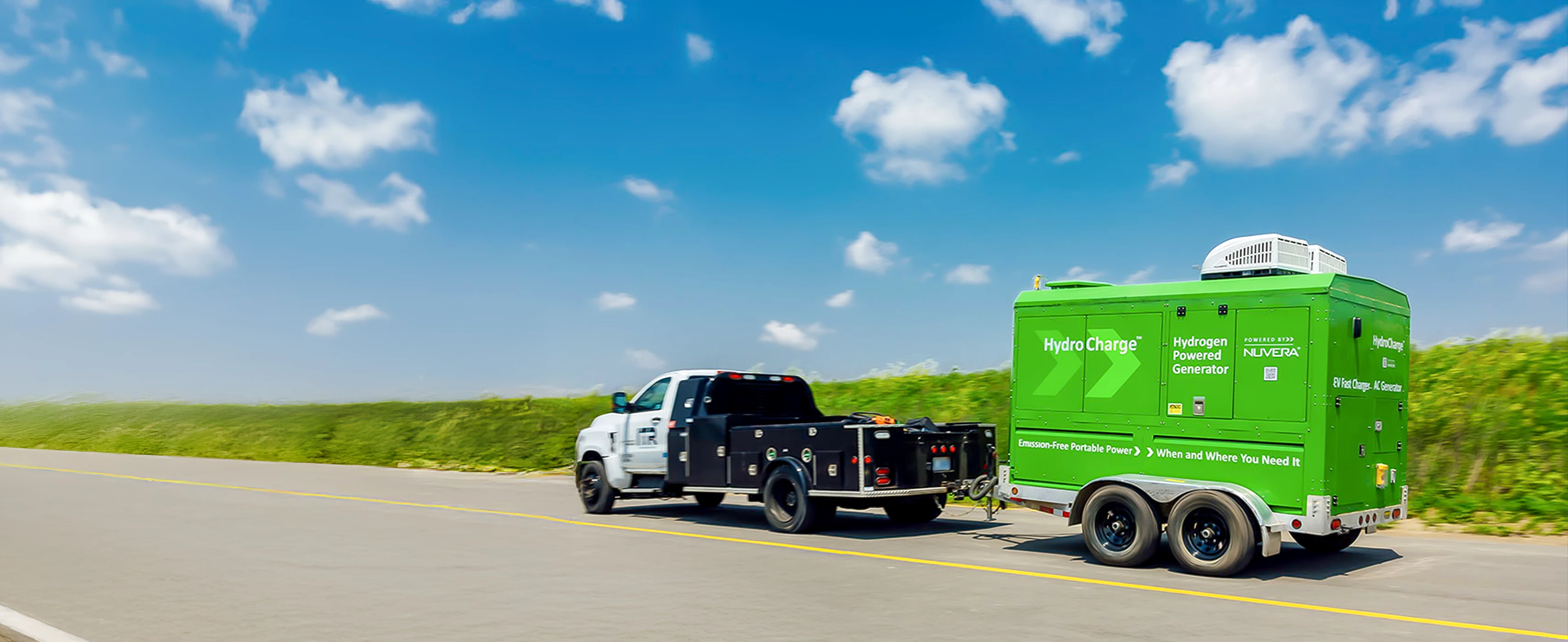Service vehicle pulling a HydroCharge mobile charging unit.