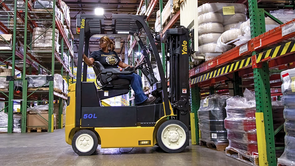 Person picking orders on Yale electric counterbalanced lift truck. 