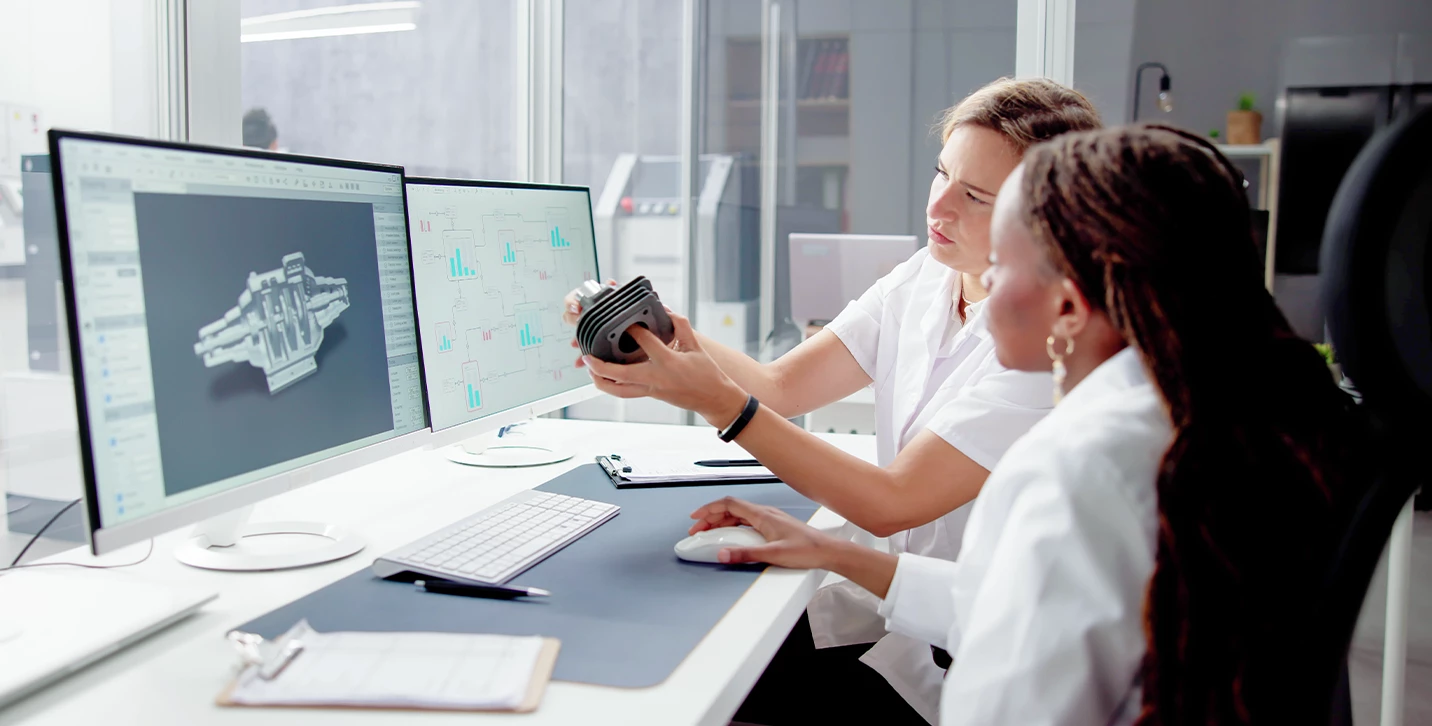 People evaluating manufacturing parts.  