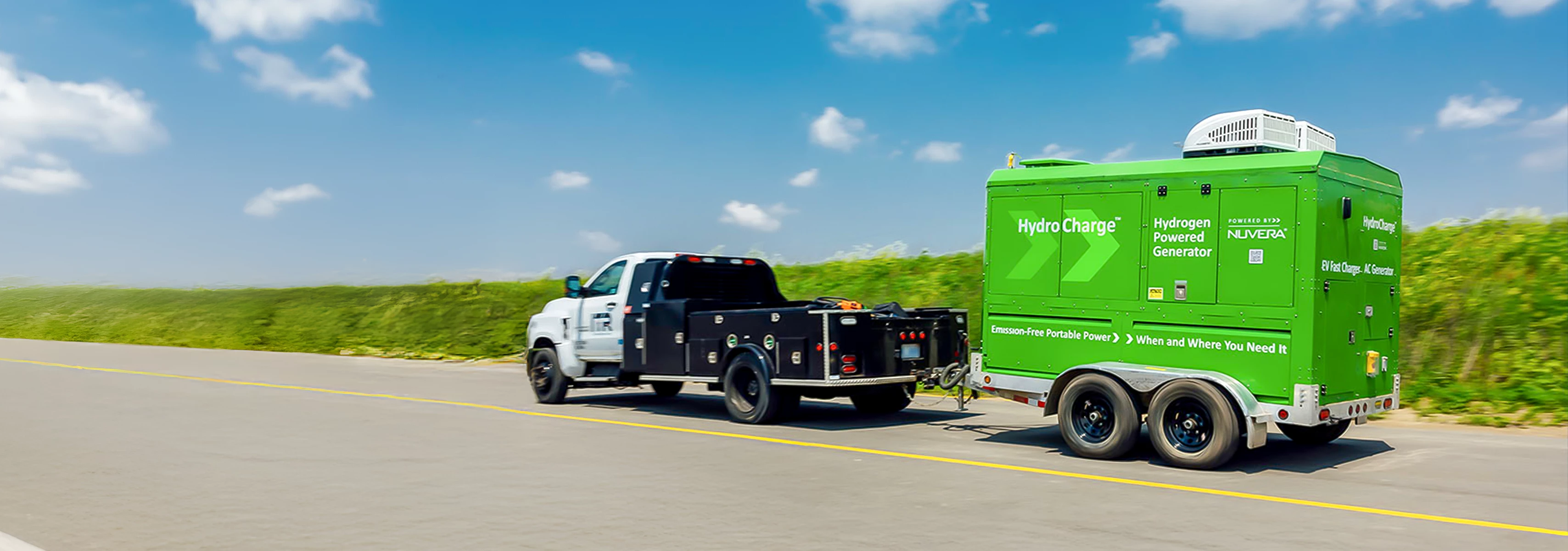 Service vehicle pulling a HydroCharge mobile charging unit.